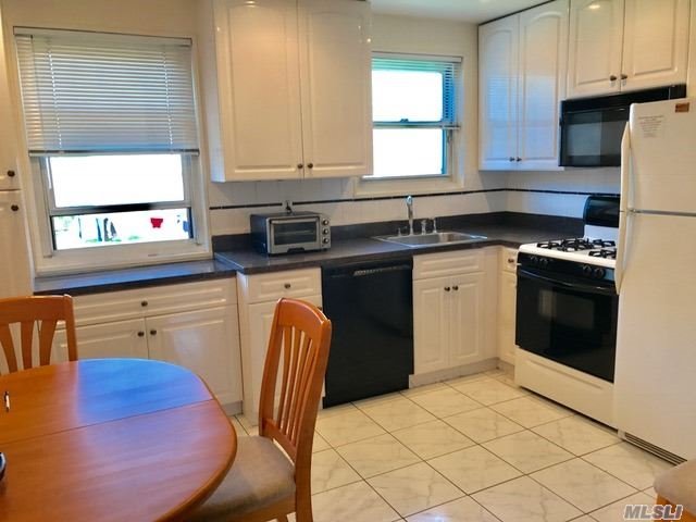 Fully Renovated Beauty Featuring Model Style Kitchen, Hardwood Floors, Situated In Quiet Area In Development, Close To Shops, Transportation, Schools