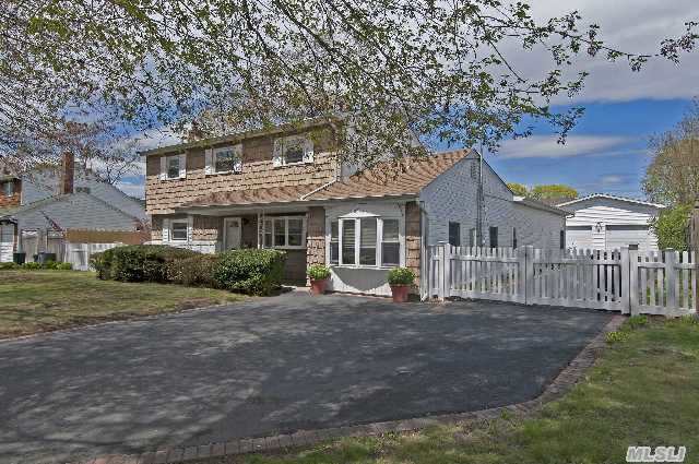 Expanded In 2006 This Splanch Features Sizeable Extension Along Eastside Of House. Glass Sunroom & Vaulted Ceilings In Lr & Dr Provide The Drama. Every Guy's Dream Garage Is Just One Of The Numerous Perks Found Here.