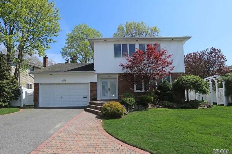 Recently Redone From Top To Bottom, This Light And Bright Colonial On Over-Sized Property Offers: Wood/Granite Eik W/Ss Appliances/Gas Cooking, New Frig, Sunken L/R W/Banded H/W Floors, Den W/Fplc & Sliders To Yard, All Redone Baths, H/W Thru-Out, Andersen Wdws, Surround Sound In/Out, Hi-Hats, Cable Ready In Every Room, Alarm, Pavers, Prof. Landscaped, Pvc Fence, Sump Pump, French Drain, Flood Zone X. Just Pack And Move In!!