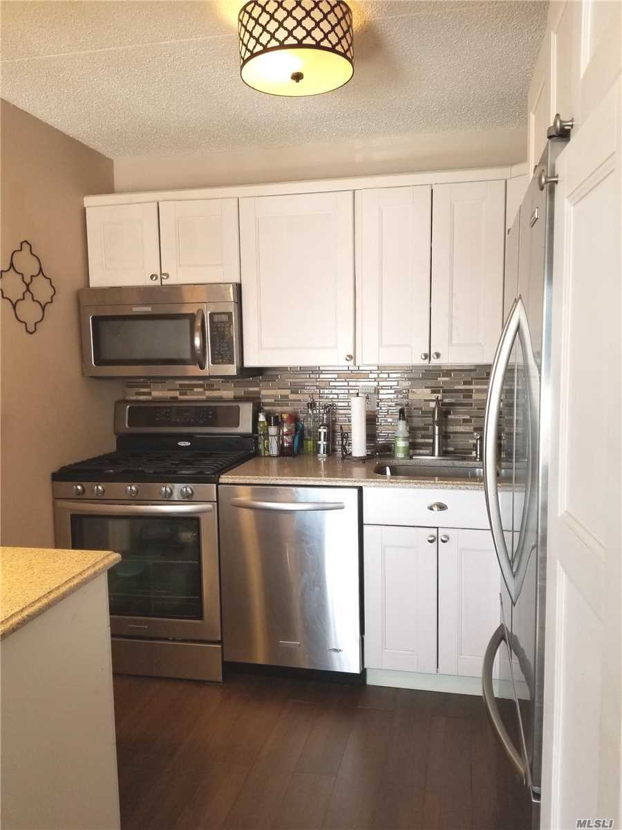 Renovated unit in Gated community with water & city views, close to McNeil Park. 2bd/2bth unit w/ Lg terrace,  stainless steel app. Alarm, Wood tile floors, plenty of closets, W/D in unit. Att. 1 car garage & spot.