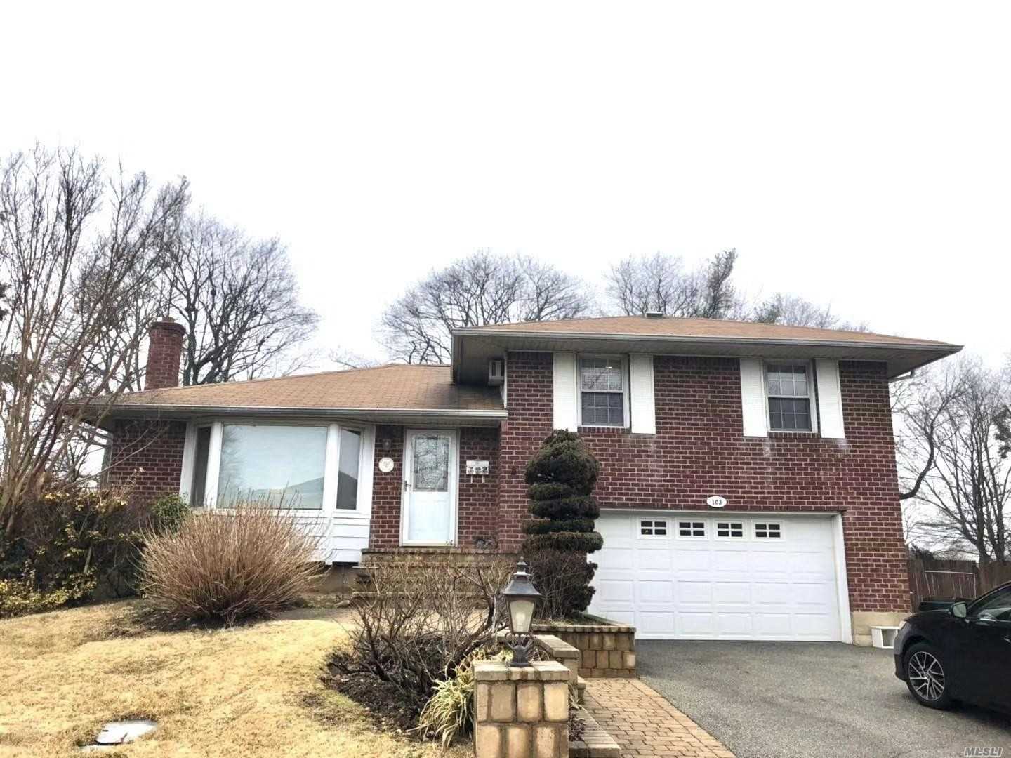 New Listing! 4 bedrooms & 2.5 baths on 80X150 Property with two-car garage + two car driveway. Face south with warm and Sun filled Spacious rooms. Beautiful skylight in eat-in kitchen. Close to LIRR and Shopping.