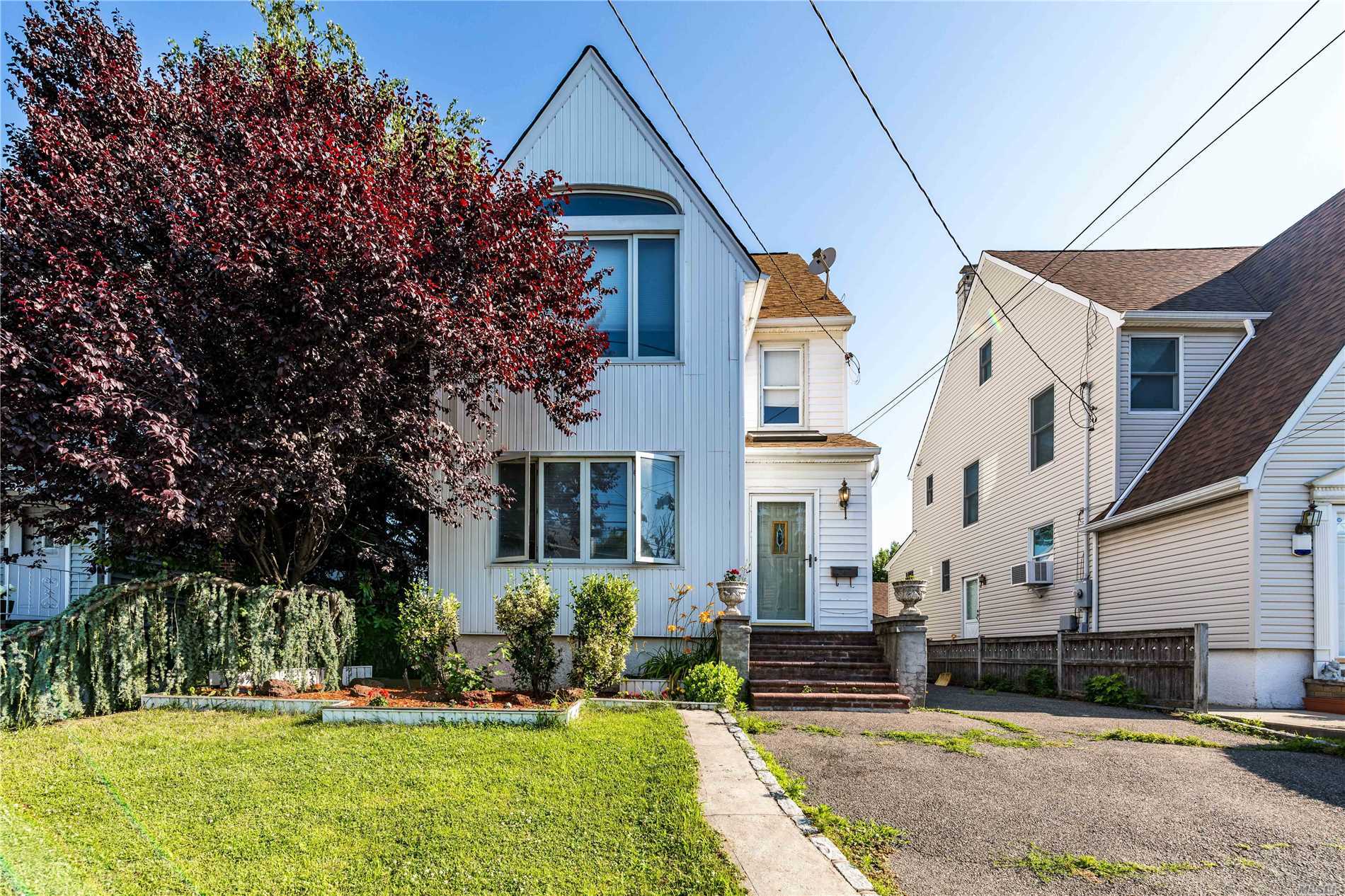Gibson Colonial With Updated Kitchen & Baths. Updated Windows, Heat & Electric Box. Large Walk Up Attic And Finished Basement With Ose. Banquet Size Formal Dining Room With Extended Living Room. Seconds From Lirr, Parks & Shops.