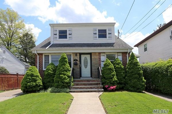 Expanded dormered Cape in quiet mid block location. You must see it. Four spacious bedrooms, Eat-in Kitchen with granite counter-tops, Family Room, Office, wot new baths, gas boiler. Beautiful backyard, living room with hi-hats. Convenient to shopping, LIRR, and LIE. Roof only 12 years old. Must see it to appreciate!