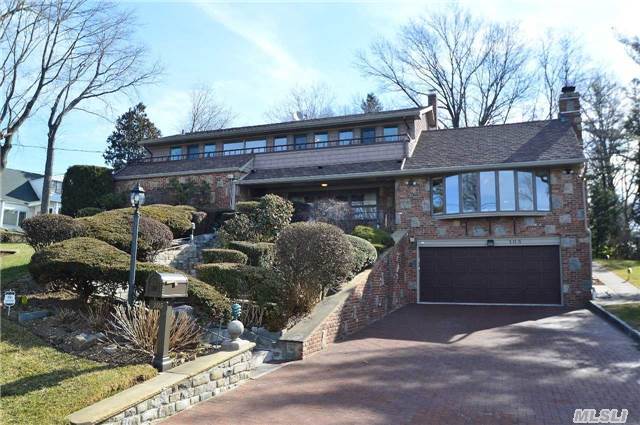 Magnificent Contemporary With Direct Waterview Set Up On The Hill. Renovated Lg Eik & Bth. Large Entertaining Area, 2 Dens W/Fpls, Lr, Dr, 5 Brs, 3 Bths & Finished Bsmt, Elevator From Garage, Alarm & Security Cameras, Genarator. Convinient To Park, Houses Of Workship & Transportation.