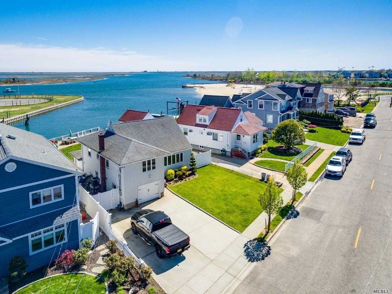 Completely-Renovated, Cozy Split-Style Home Right Off The Bay But With The Protection Of A Canal-- Perfect For Any Boater! Located Within Gorgeous Massapequa Shores & Sits On Pristine Block Filled W/ Nice Homes. Breathtaking Bayviews Complemented By Florence Beach A Mire Footsteps Away! This Like-Brand-New Home Includes: Custom Kitchen & Vanities W/ Granite Ctops + Ss Prof Appliances (Gas), Gleaming Oak Floors, Lots Of Closet Space, New Dock & Pvc-Faced Bulkhead In Mint Condition, + Much More!