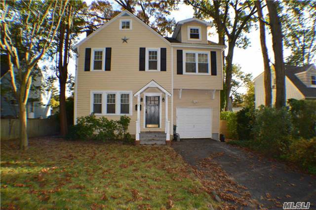 Charming 4-Bedroom/3-Bath Colonial, Expanded/Renovated In 2009, Offering Large Kitchen, Hardwood Flooring Through Out, New: Ext Paint, Windows, Doors, Plumbing, Cesspools, Oil Tank, Electric Service & More! Large Deck W/Two Stairways To Backyard. Non-Flood Zone. Taxes Being Grieved.