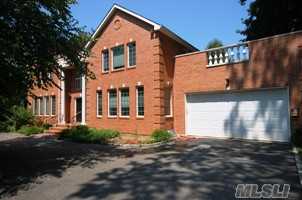 New Brick Colonial With Gracious Entry Hall Opens To The Living Room, Dining Room With Fireplace And Inviting Den. Huge Custom-Built Kitchen & Powder Room. The  Majestic Staircase Leads To  Master Suite W/Master Bath & Jacuzzi. There Are Also 2 Other Baths & 3 Additional Large Bedrooms.  Circular Driveway. Full Basement, Central Vac & 2 Car Garage.