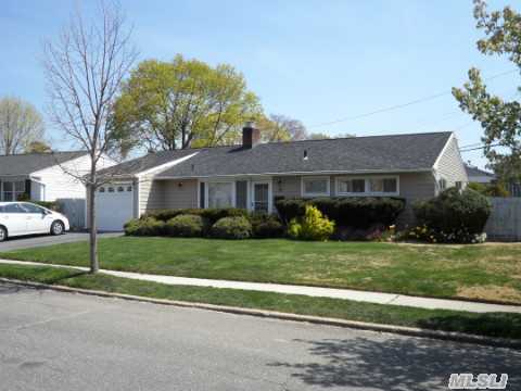 Wow...Expanded Ranch With 4 Brs, 1.5 Baths And Garage In Desirable Syosset Groves!  Totally Updated And Expanded W/Maple Hw Floors, New Granite Eik, New Roof, New Siding, New Garage Door, Huge Great Room W/Dual Fireplace, Vaulted Ceiling And Skylights Leading To Bi-Level Deck Perfect For Entertaining, 2-Car Driveway, And Much, Much More!