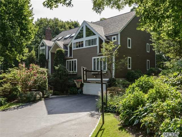 Majestic Center Hall Colonial In Roslyn Pines. 2 Story Foyer, Large Lr W/Fp, Grand Fdr With French Doors, Fam Rm W/Custom Built Ins And Fplc, Pwdr, Custom Kitchen/Breakfast Nook To Breathtaking Heated Atrium. Guest Br/Fbth, Mbr/Fbth, 2nd Flr:, Grand Master Suite With Terrace Looking (Winter Water View)Mbths, Br, Br, Fbth, Br/Fbth. Elevator, Generator, Full Bsmnt, 2 Car Garage