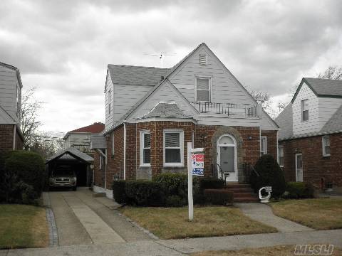 Lovely Solid Brick House In Excellent Condition! New Windows & Sprinkler System And Central Alarm System. Prime Location With R2 Zoning. 