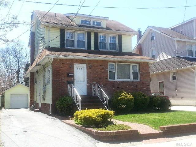 Great 2 Family Home In Lynbrook Featuring:  Large Living Room,  3 Bedrooms,  2 Full Baths,  Walk Up Attic,  Double Driveway,  Full Finished Basement,  New Pvc Fence. **** Tenants Occupied - Please Give 24 Hour Notice ****