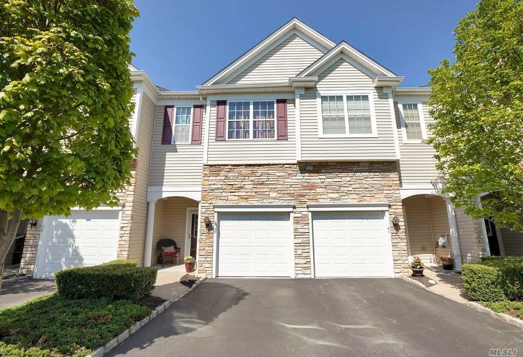 Beautifully Maintained Townhouse,  2 Bdrm.2.5 Bths.in 55+ Condo Community with Full Finished Basement, Elevator to Every  Floor, Open Layout, HW Floors, LR overlooking Balcony, SS Appliances; Master Bdrm. Suite, Guest Bdrm. w/Full Bath, Walk-in Closet. Basement with 1/2 Bth., Storage. Enjoy Activities in a Magnificent Clubhouse with Gym, Community Pool. Immaculate Landscaped Grounds. Minutes to RR, Pkwys. Golf Course, YMCA, Restaurants, Fire Island Ferries.