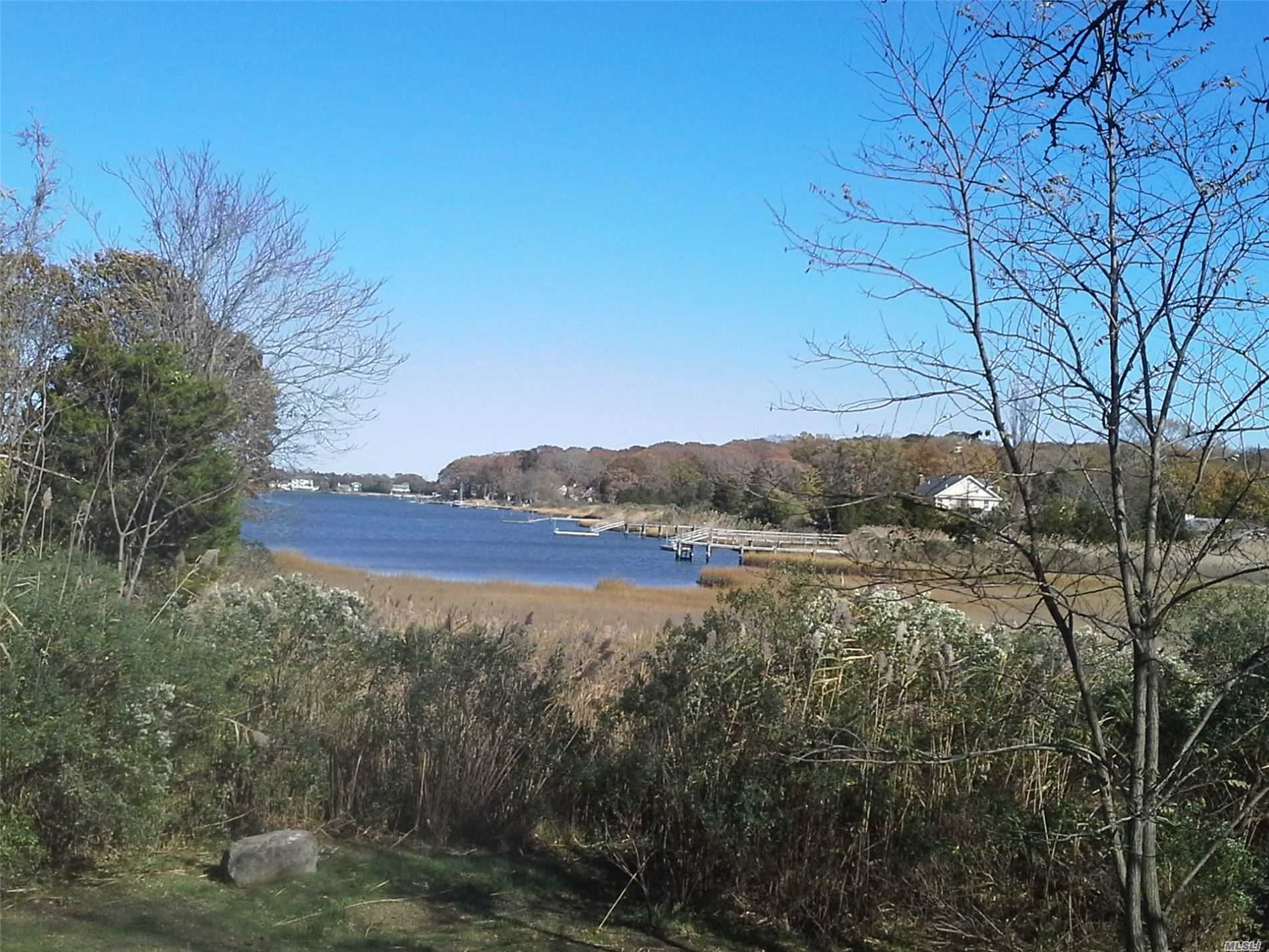 Charming 2, 500+ Sq. Ft. Home with Creek Views on .75 Ac. 3/4 Bedrooms, 2 Baths, Large Living Room  Kitchen, Dining Area. family rm large closets Bay Beach Nearby.