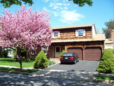 Spacious 4 Br Colonial. Close To Village  & Lirr. 3 Zone Heat, 2 Zone Cac. Kitchen Has New Wood Cabinets & Appliances. Fenced Yard & 2 Car Garage. Village Elementary & Southwoods Middle Schools.  Buyer Can Apply For Star Exemption Of $1310