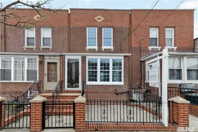 Totally Renovated Townhouse In The Heart Of Astoria,  New Kitchen,  2 New Baths,  Garage,  New Wood Floors,  Close To Train And All Major Parkways. Must See Home.