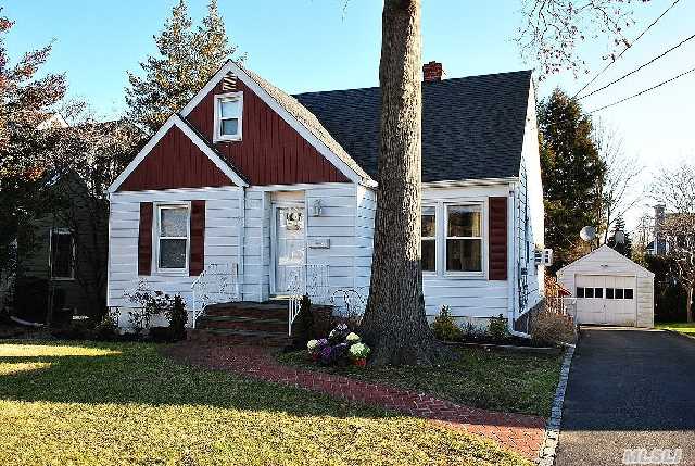 This Home Has It All. This Home Features 2 Bedrooms On The 1st Floor,  Formal Living Room, Formal Dining Room, Large Eat-In Kitchen W/Access To Large Deck. Full Finished Basement With Seperate Out-Side Entrance,  Cedar Closet,  Summer Kitchen, Full Bathroom, 2 Additional Bedrooms On 2nd Floor, Office,  Large Walk In Closet. Walking Distance To School,  Train And Shopping Center.